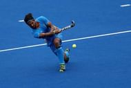 RIO DE JANEIRO, BRAZIL - AUGUST 08:  Rupinder Pal Singh #3 of India passes the ball against Germany during a Men's Pool B match on Day 3 of the Rio 2016 Olympic Games at the Olympic Hockey Centre on August 8, 2016 in Rio de Janeiro, Brazil.  (Photo by Sean M. Haffey/Getty Images)